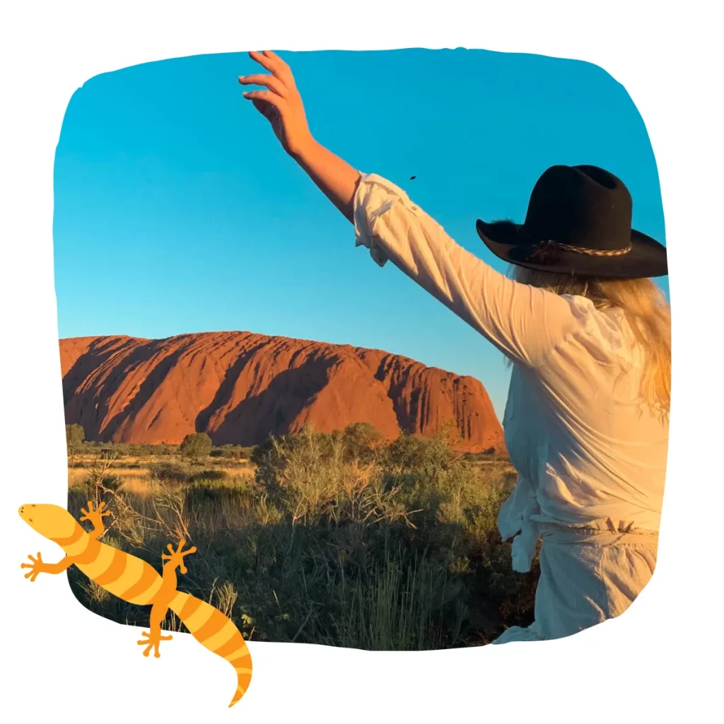 uluru with a lizard in the sunset