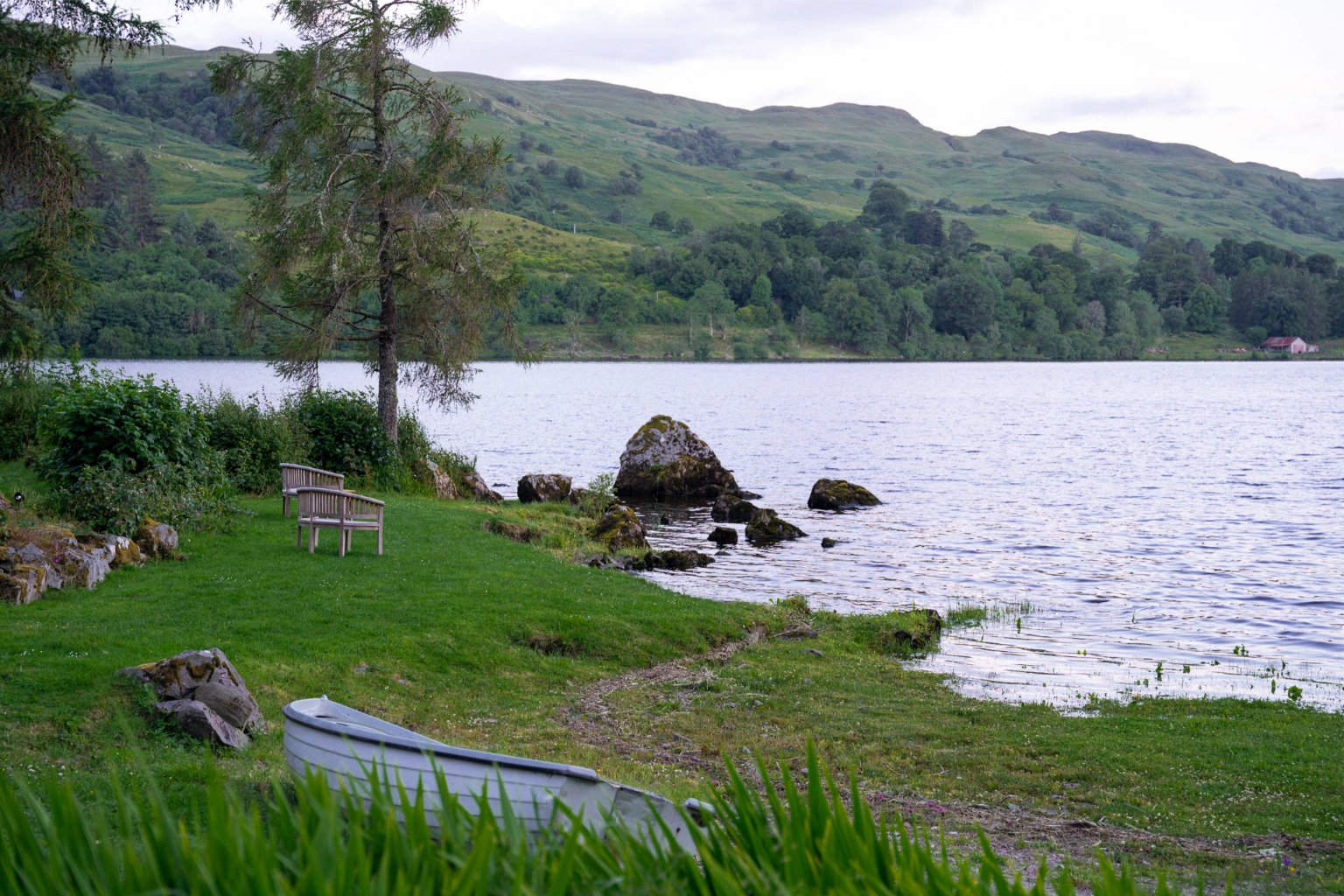 view on scottish loch at sunset scotland travel