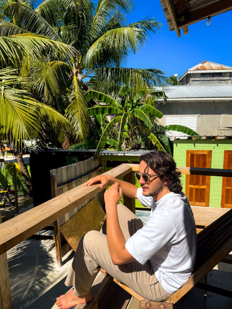 Belize caye caulker travel bella's backpackers hostel with tropical palm trees